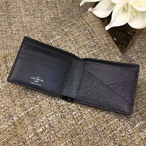 lv taiga multiple wallet|MULTIPLE WALLET Taiga Leather .